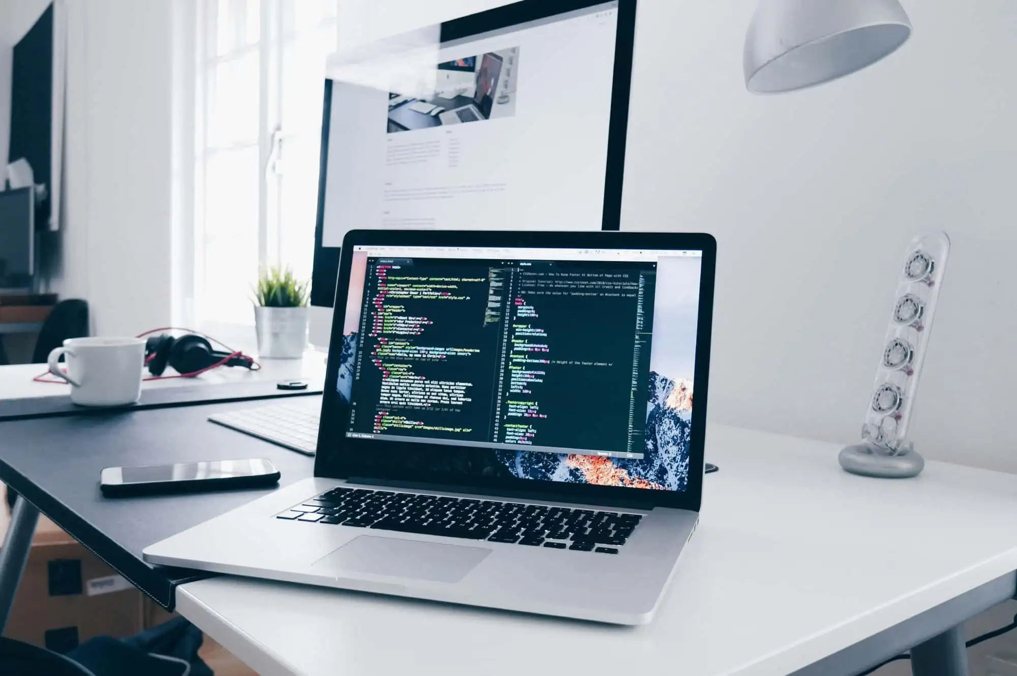 Laptop on a web developer's desk