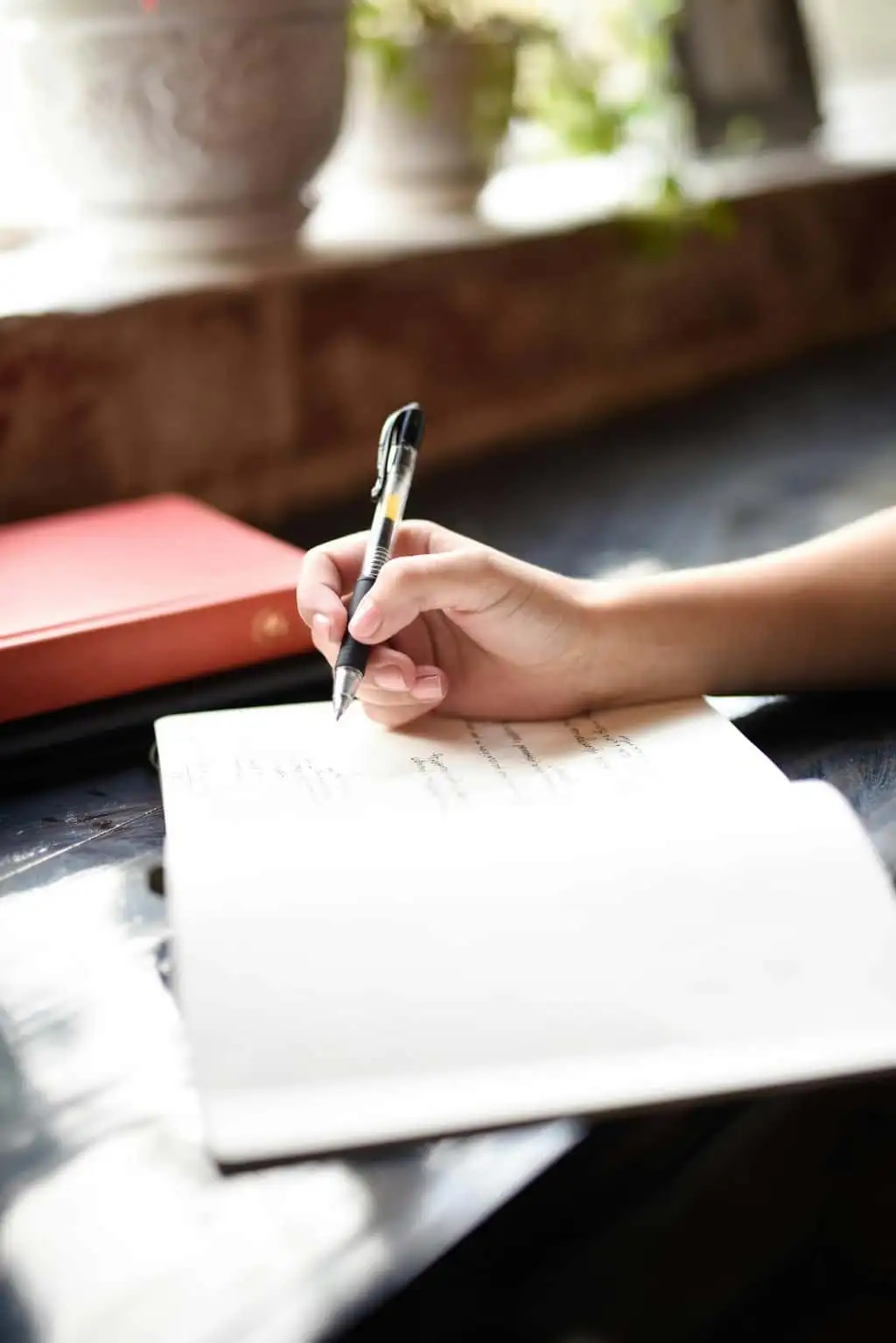 Sketching design ideas in a notebook
